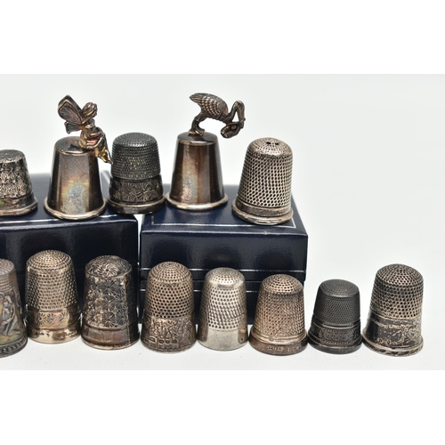 140 - A SELECTION OF SILVER THIMBLES, twenty-six thimbles in total, various designs and patterns, all with... 