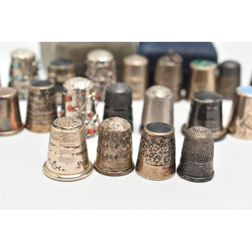 141 - A SELECTION OF SILVER THIMBLES, twenty-two thimbles and a silver tooth fairy trinket box, various de... 