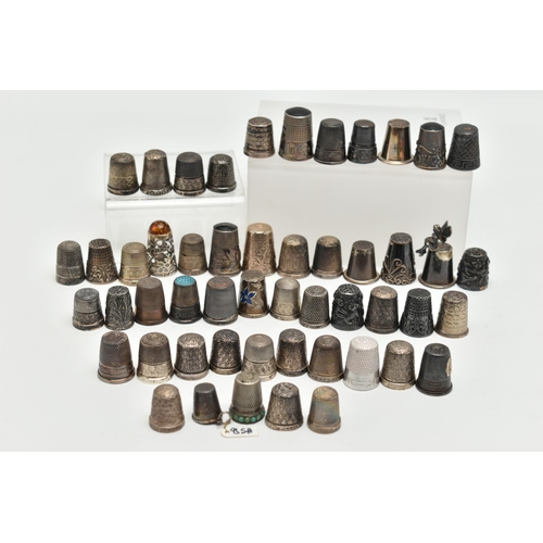 142 - A BAG OF WHITE METAL THIMBLES, various designs and patterns, some set with semi-precious stone termi... 