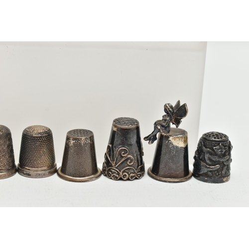 142 - A BAG OF WHITE METAL THIMBLES, various designs and patterns, some set with semi-precious stone termi... 