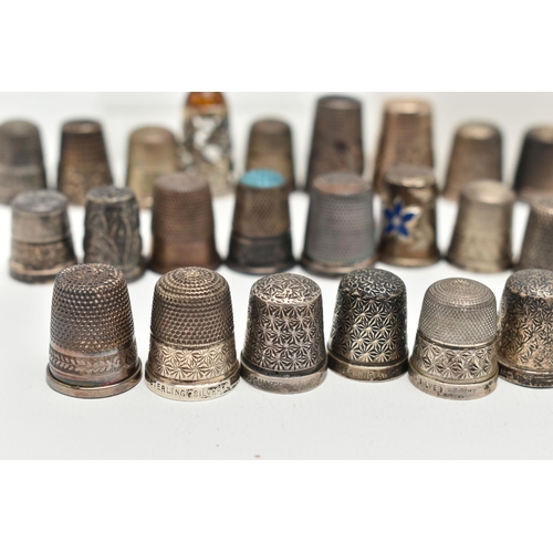 142 - A BAG OF WHITE METAL THIMBLES, various designs and patterns, some set with semi-precious stone termi... 