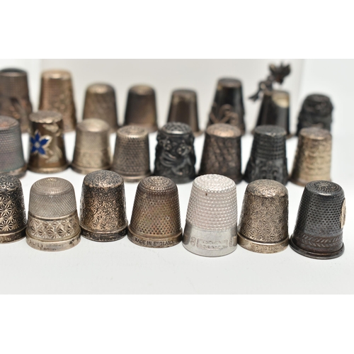 142 - A BAG OF WHITE METAL THIMBLES, various designs and patterns, some set with semi-precious stone termi... 