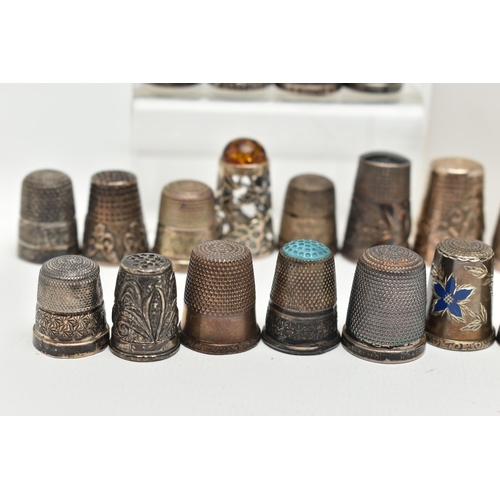 142 - A BAG OF WHITE METAL THIMBLES, various designs and patterns, some set with semi-precious stone termi... 