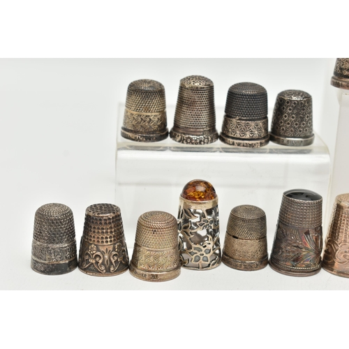 142 - A BAG OF WHITE METAL THIMBLES, various designs and patterns, some set with semi-precious stone termi... 