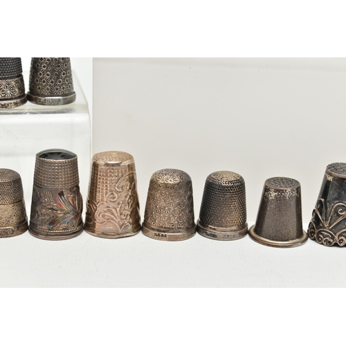 142 - A BAG OF WHITE METAL THIMBLES, various designs and patterns, some set with semi-precious stone termi... 