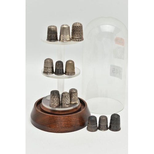 145 - TWELVE 'CHARLES HORNER' SILVER THIMBLES AND A DOMED GLASS DISPLAY CASE, all hallmarked 'Charles Horn... 