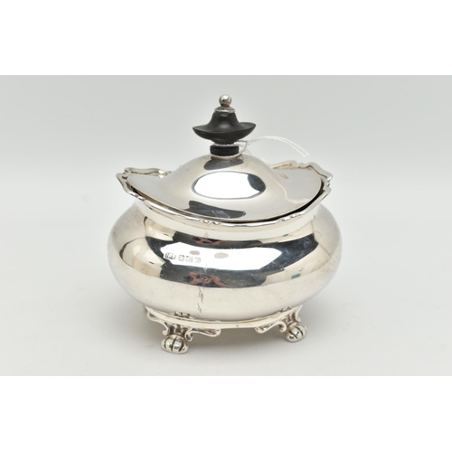 149 - A GEORGE V SILVER TEA CADDY OF OVAL FORM, the hinged cover fitted with an ebony finial, on four paw ... 