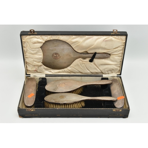 173 - A CASED SILVER VANITY SET, to include four brushes and a mirror (comb is missing), engine turned pat... 