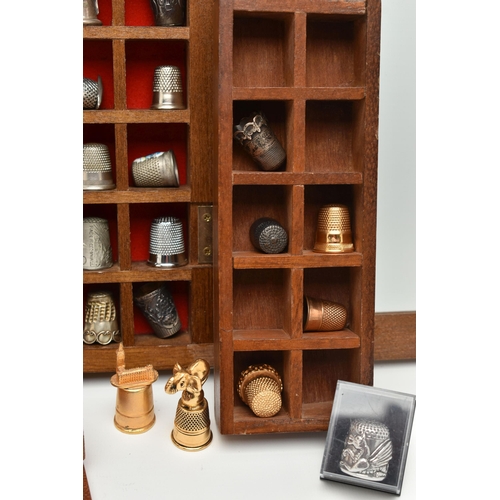 177 - ASSORTED WHITE METAL THIMBLES AND THIMBLE DISPLAY CASES, to include a wooden fifty piece wall hangin... 