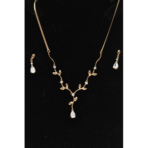 217 - A 9CT GOLD NECKLACE AND DROP EARRINGS, the necklace designed as a V-shape foliate line set with circ... 