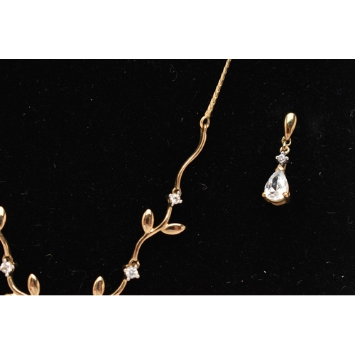 217 - A 9CT GOLD NECKLACE AND DROP EARRINGS, the necklace designed as a V-shape foliate line set with circ... 