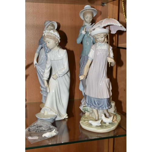 329 - FOUR LLADRO AND NAO FIGURES, comprising two Lladro figures: Reading no 5000, sculptor Francisco Cata... 