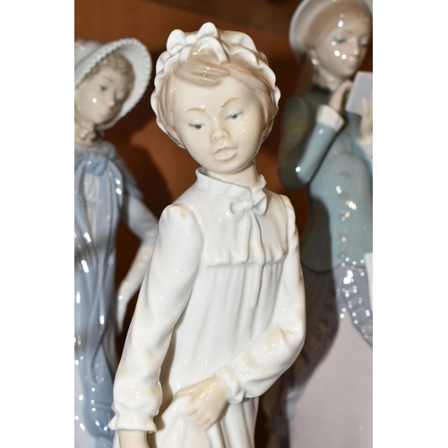 329 - FOUR LLADRO AND NAO FIGURES, comprising two Lladro figures: Reading no 5000, sculptor Francisco Cata... 