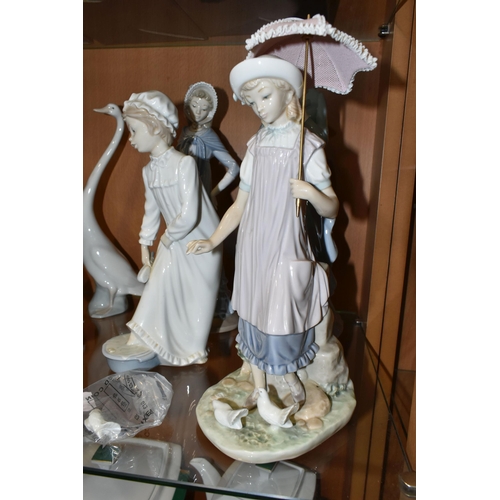 329 - FOUR LLADRO AND NAO FIGURES, comprising two Lladro figures: Reading no 5000, sculptor Francisco Cata... 