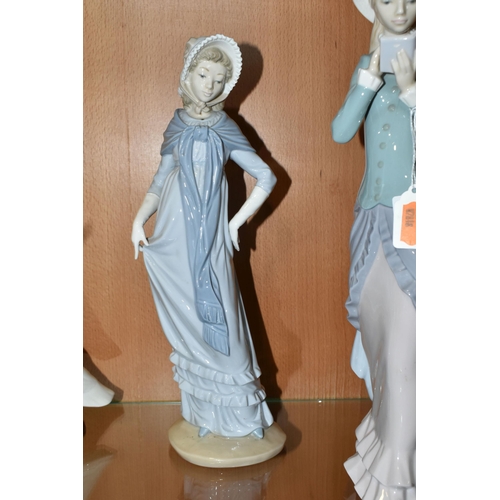 329 - FOUR LLADRO AND NAO FIGURES, comprising two Lladro figures: Reading no 5000, sculptor Francisco Cata... 