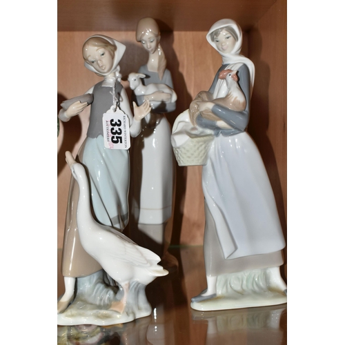 335 - A GROUP OF THREE LLADRO FIGURINES, comprising 4591 'Girl With a Cockerill', 4595 'Girl with Lamb' an... 