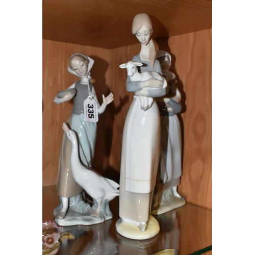 335 - A GROUP OF THREE LLADRO FIGURINES, comprising 4591 'Girl With a Cockerill', 4595 'Girl with Lamb' an... 