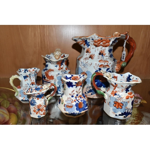 336 - A COLLECTION OF SIX 19TH CENTURY GRADUATIMG MASON'S IRONSTONE IMARI PATTERN 'HYDRA' JUGS, decorated ... 