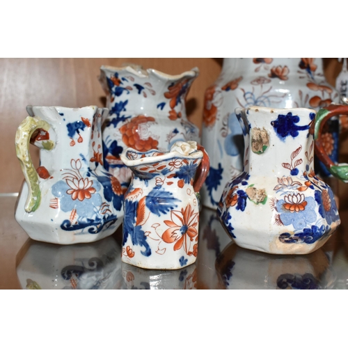 336 - A COLLECTION OF SIX 19TH CENTURY GRADUATIMG MASON'S IRONSTONE IMARI PATTERN 'HYDRA' JUGS, decorated ... 