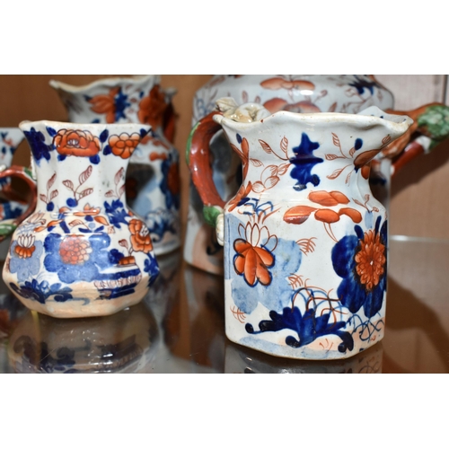 336 - A COLLECTION OF SIX 19TH CENTURY GRADUATIMG MASON'S IRONSTONE IMARI PATTERN 'HYDRA' JUGS, decorated ... 