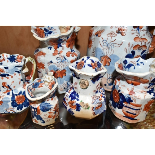 336 - A COLLECTION OF SIX 19TH CENTURY GRADUATIMG MASON'S IRONSTONE IMARI PATTERN 'HYDRA' JUGS, decorated ... 