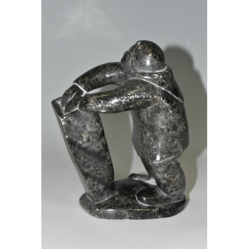 343 - A CANADIAN INUIT SOAPSTONE CARVING, of an Inuit fisherman, height approx. 20cm, inscribed marks to b... 