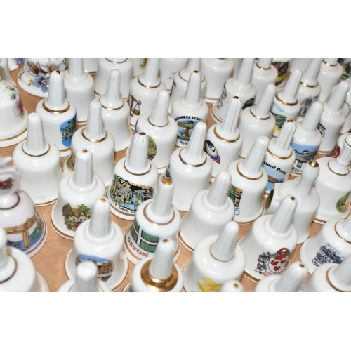 344 - THREE BOXES OF PORCELAIN BELL ORNAMENTS, over two hundred miniature holiday souvenir bells together ... 