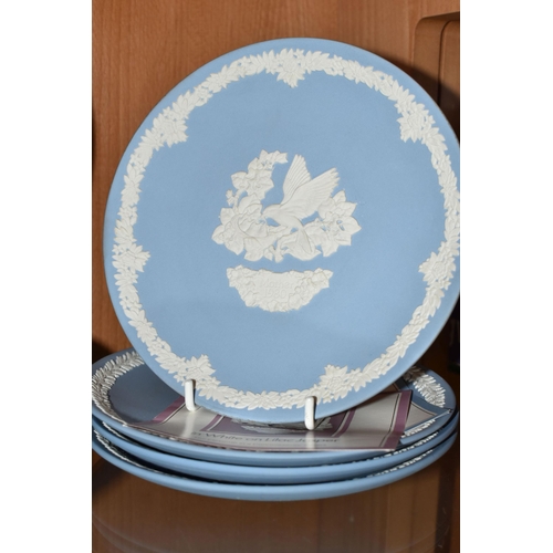 358 - A LARGE COLLECTION OF WEDGWOOD JASPERWARE CHRISTMAS PLATES AND GIFTWARE, comprising fourteen Christm... 