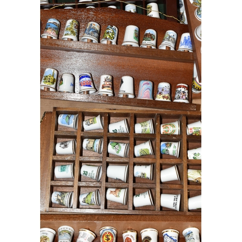 364 - ONE BOX OF CERAMIC THIMBLES, comprising a large collection of over one hundred holiday souvenir thim... 