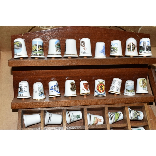 364 - ONE BOX OF CERAMIC THIMBLES, comprising a large collection of over one hundred holiday souvenir thim... 