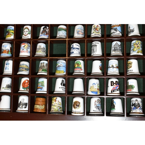 364 - ONE BOX OF CERAMIC THIMBLES, comprising a large collection of over one hundred holiday souvenir thim... 