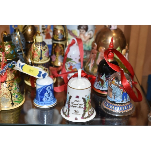 376 - SEVENTEEN CHRISTMAS THEMED BELLS, to include a Capodimonte bell with some restoration to the inside ... 