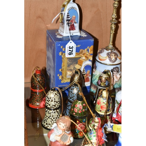 376 - SEVENTEEN CHRISTMAS THEMED BELLS, to include a Capodimonte bell with some restoration to the inside ... 