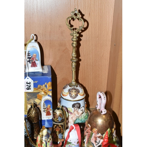 376 - SEVENTEEN CHRISTMAS THEMED BELLS, to include a Capodimonte bell with some restoration to the inside ... 