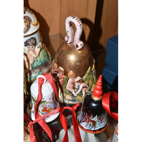 376 - SEVENTEEN CHRISTMAS THEMED BELLS, to include a Capodimonte bell with some restoration to the inside ... 