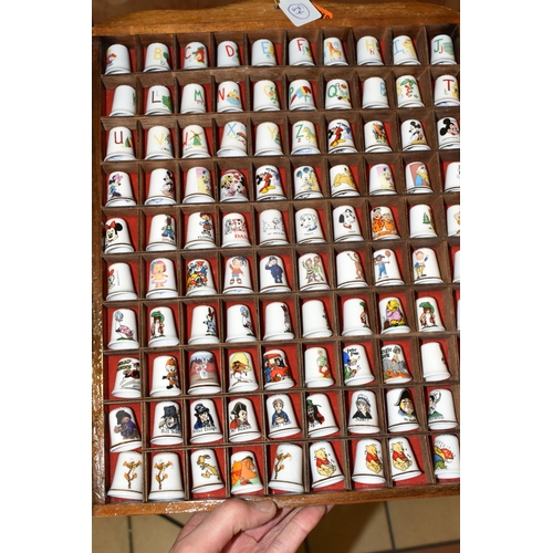 383 - A COLLECTION OF COLLECTORS THIMBLES, approximately one hundred and seventy pieces, to include charac... 