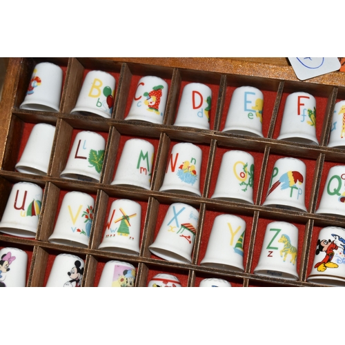 383 - A COLLECTION OF COLLECTORS THIMBLES, approximately one hundred and seventy pieces, to include charac... 