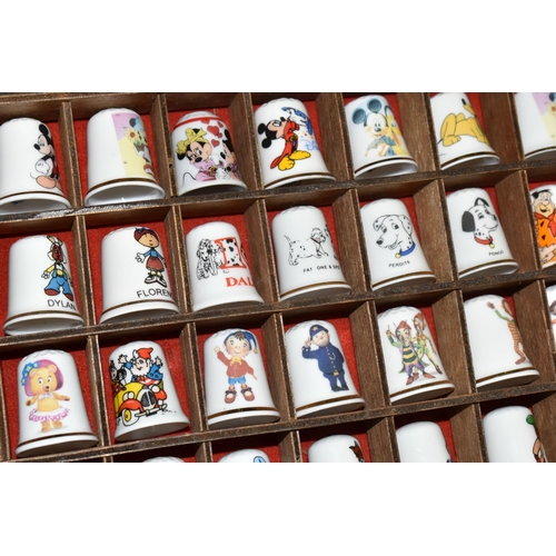 383 - A COLLECTION OF COLLECTORS THIMBLES, approximately one hundred and seventy pieces, to include charac... 