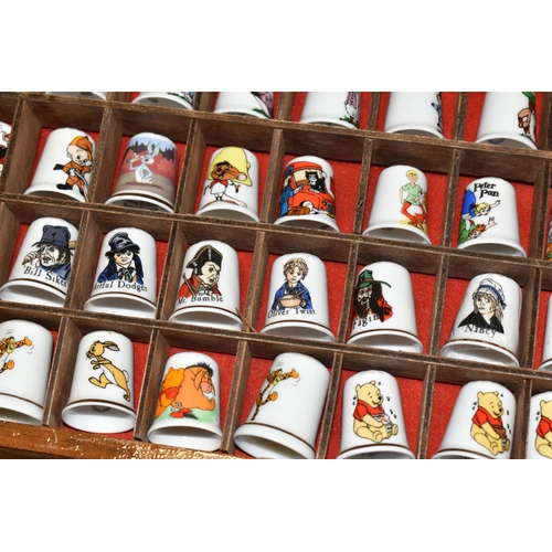 383 - A COLLECTION OF COLLECTORS THIMBLES, approximately one hundred and seventy pieces, to include charac... 