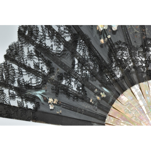 392 - THREE FOLDING FANS, comprising a boxed mother of pearl and black lace fan, with painted flowers and ... 