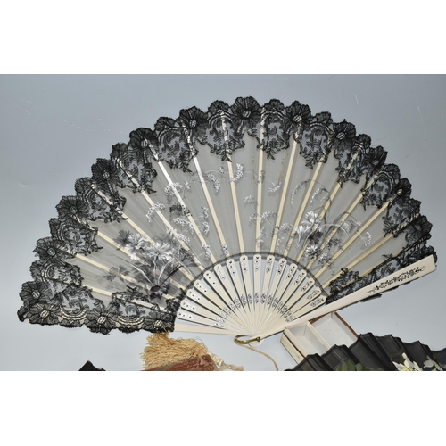 392 - THREE FOLDING FANS, comprising a boxed mother of pearl and black lace fan, with painted flowers and ... 