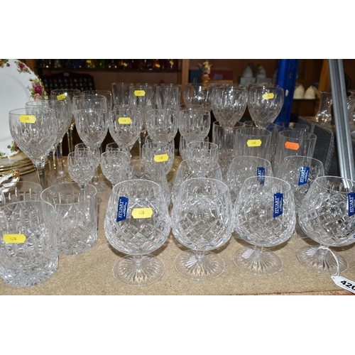 420 - A SELECTION OF STUART DRINKING GLASSES, to include eight brandy balloons, seven white wine, five lar... 