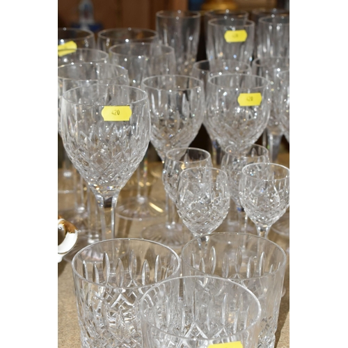 420 - A SELECTION OF STUART DRINKING GLASSES, to include eight brandy balloons, seven white wine, five lar... 