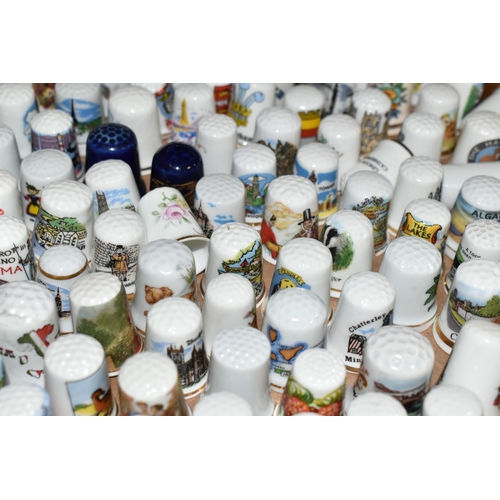 424 - TWO TRAY SEVERAL HUNDRED COLLECTORS THIMBLES, most appear to be tourist souvenirs but with a number ... 