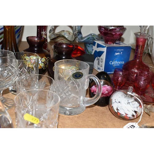 473 - A QUANTITY OF COLOURED GLASSWARE, comprising a Caithness pink swirl heart shaped trinket dish, Tutbu... 