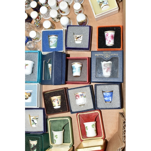 502 - A BOX OF GLASS, CERAMIC AND METAL COLLECTORS THIMBLES, to include forty-three boxed examples, Britis... 