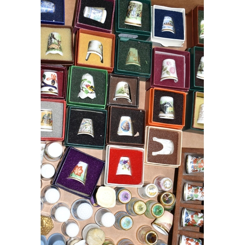 502 - A BOX OF GLASS, CERAMIC AND METAL COLLECTORS THIMBLES, to include forty-three boxed examples, Britis... 