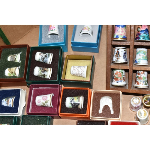 502 - A BOX OF GLASS, CERAMIC AND METAL COLLECTORS THIMBLES, to include forty-three boxed examples, Britis... 