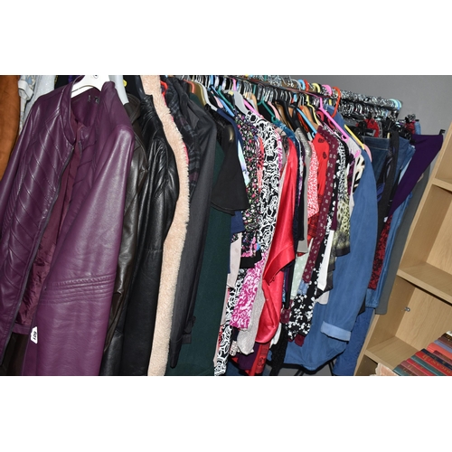 601 - A LARGE QUANTITY OF LADIES' CLOTHING, to include leather jackets, overcoats, blouses, skirts, dresse... 