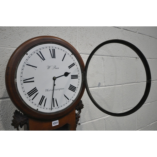 1197 - A 19TH CENTURY WALNUT WALL CLOCK, the glazed door enclosing an 11 inch enamel dial, depicting Roman ... 